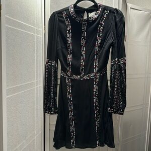 Brand new long sleeve black dress with beautiful details.